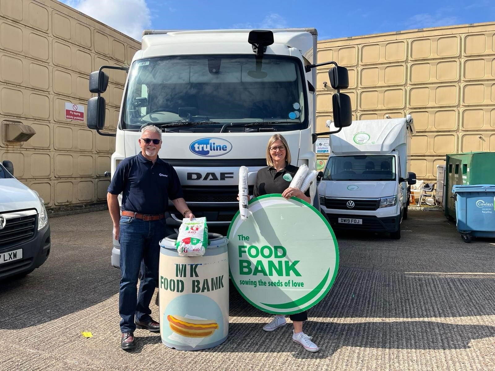 Simon Eady donating food to the MK Food